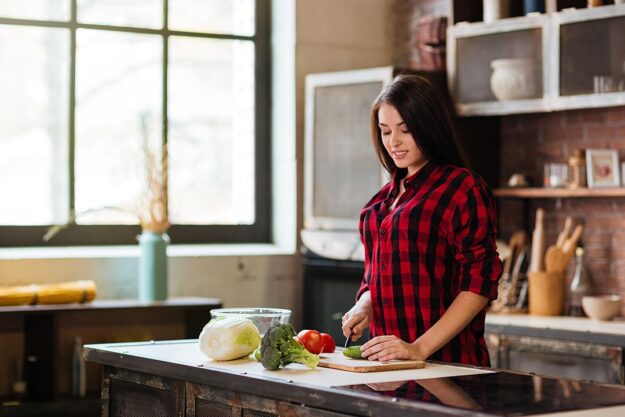 Woman cooking in kitchen kitchen backsplash